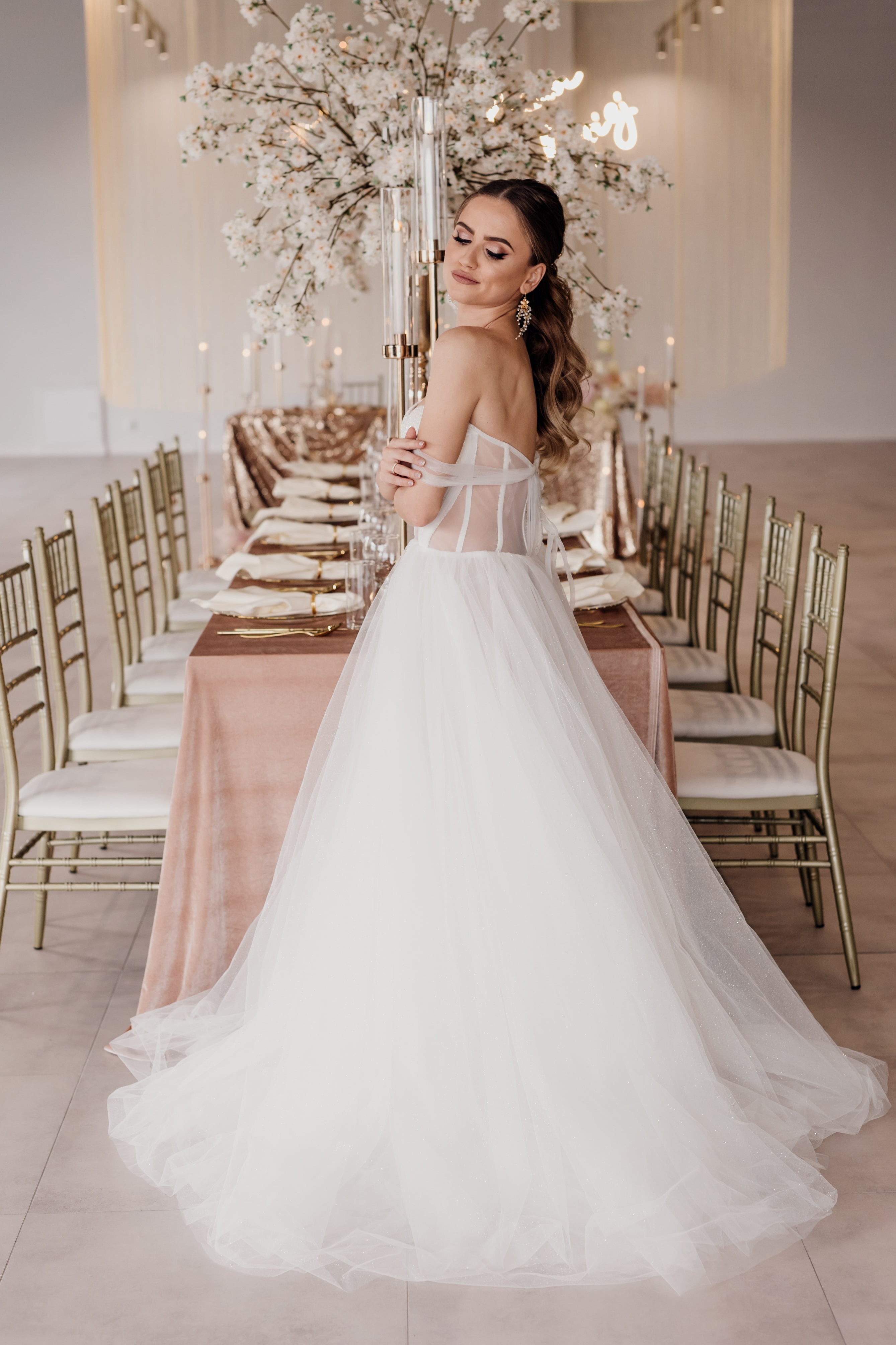 A bride in a white dress in a wedding room