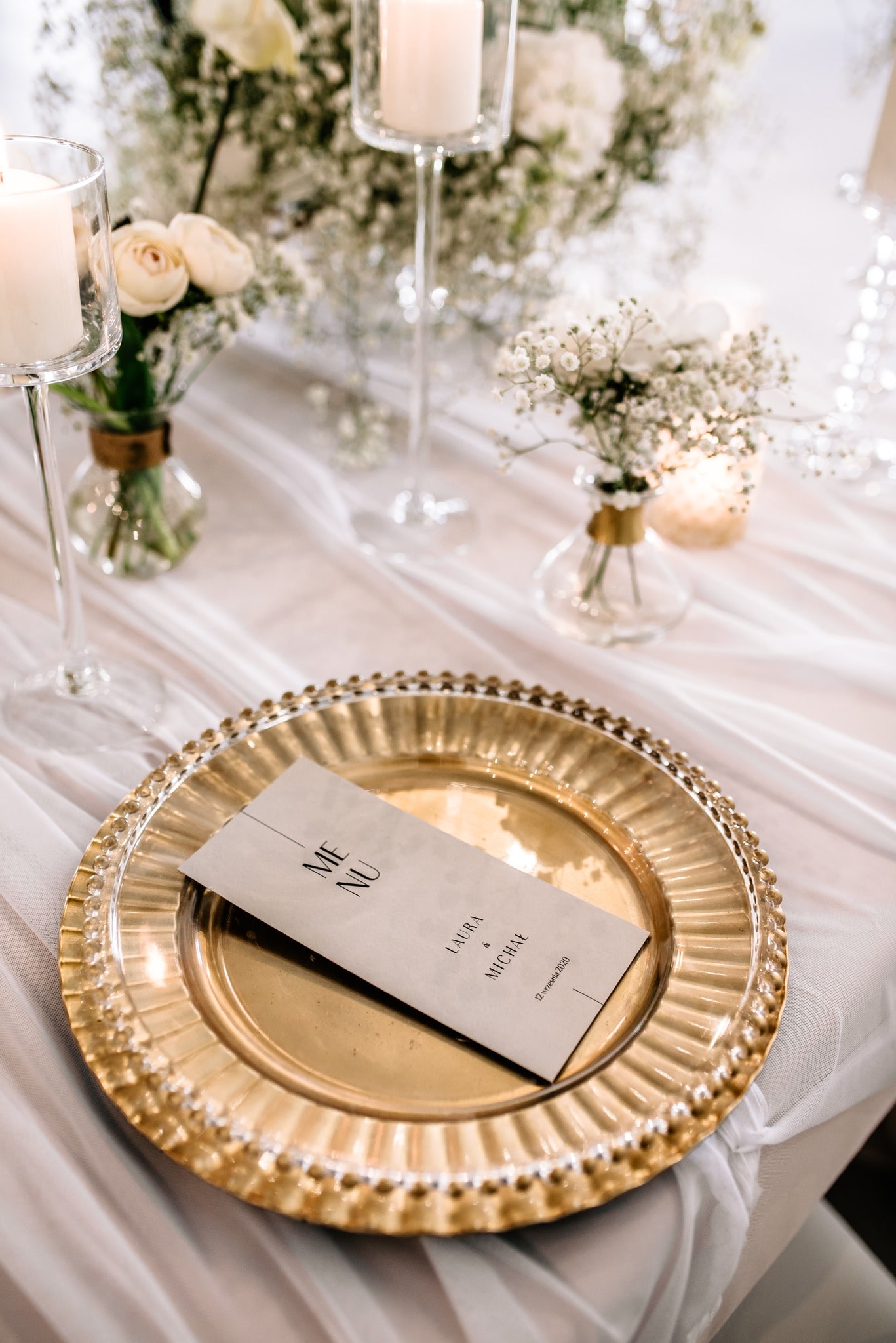 A golden plate on a wedding table